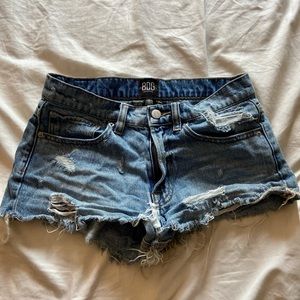 Lightly distressed blue jean shorts